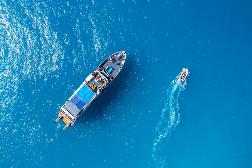 boat accompanied by smaller boat