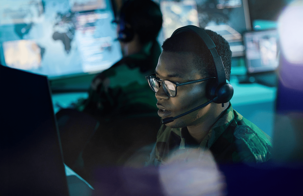 2 people working for the military at computers