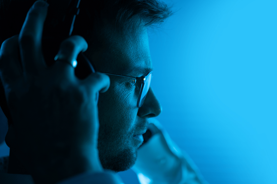 man listening in to data